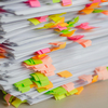 Scattered hotel brochures, price lists and banquet documents consolidated into a structured event catalog